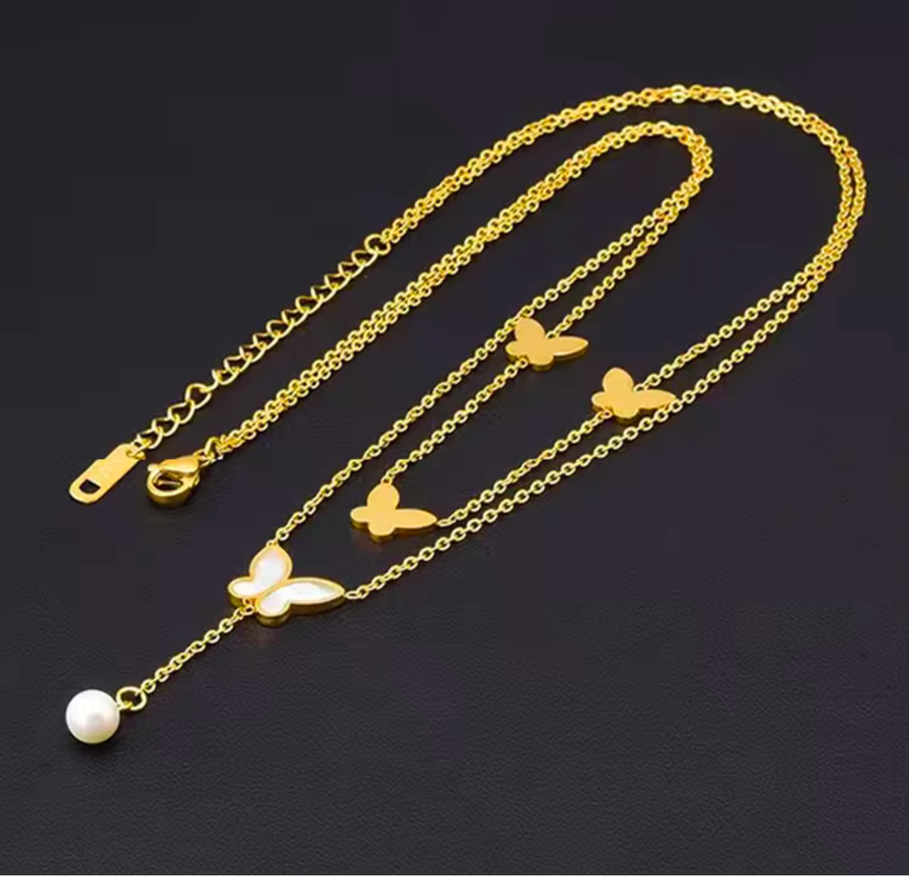 Butterfly necklace with white pearls