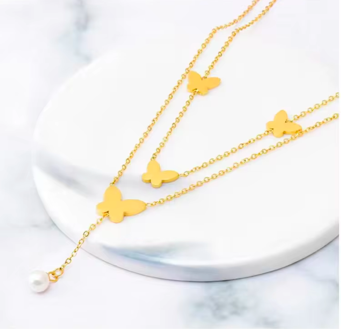 Butterfly necklace with white pearls