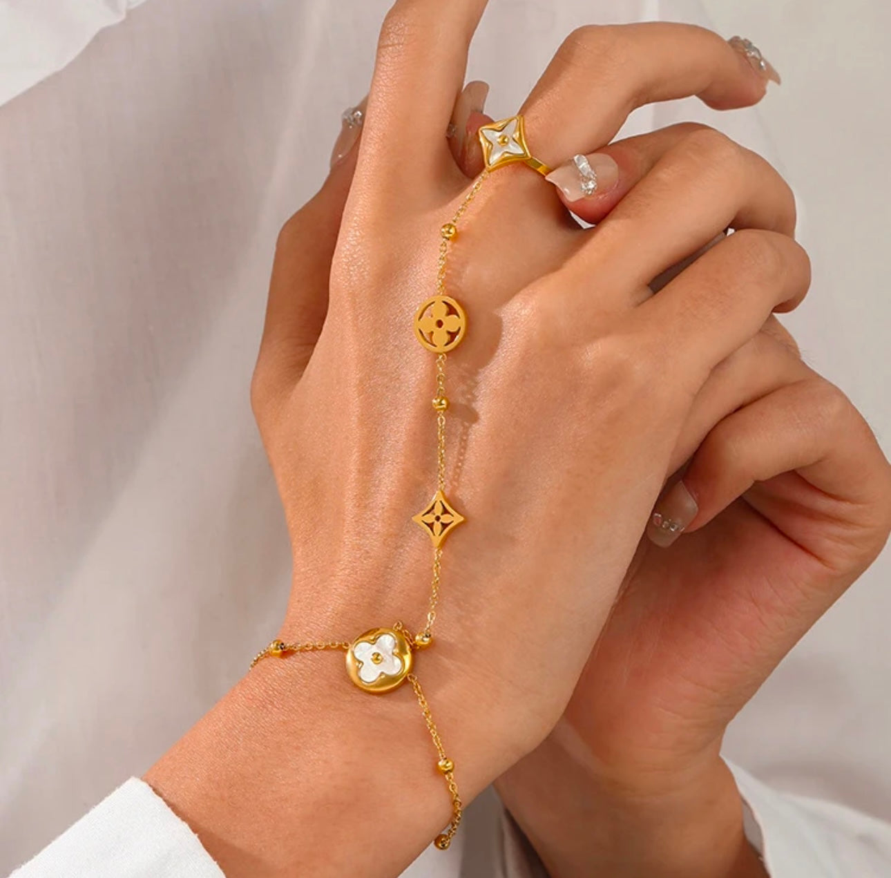 Ring with bracelet