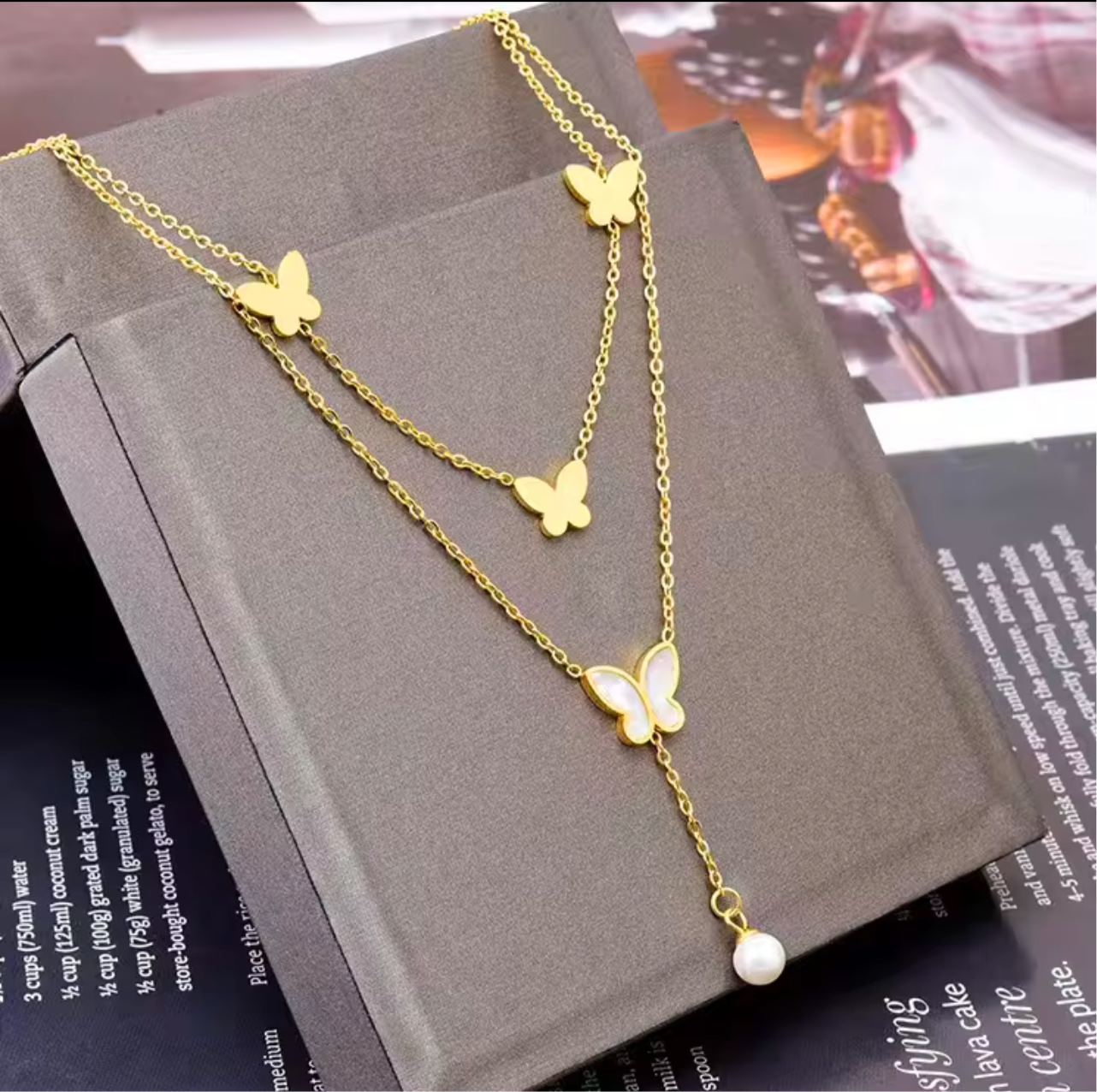 Butterfly necklace with white pearls