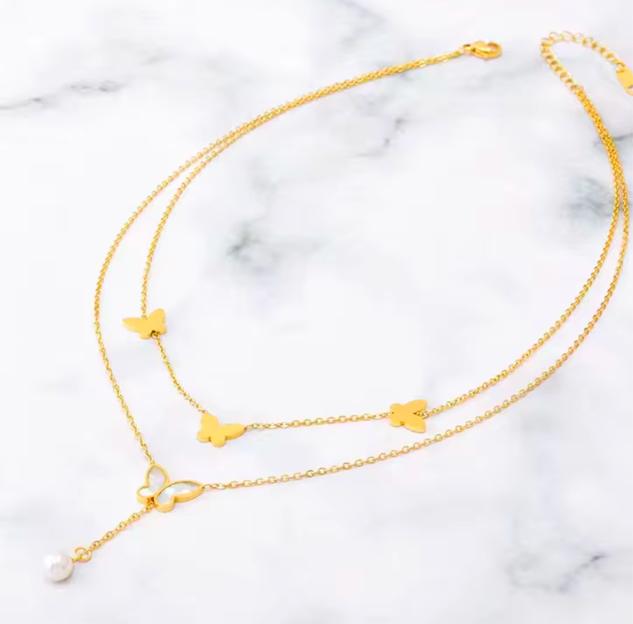 Butterfly necklace with white pearls