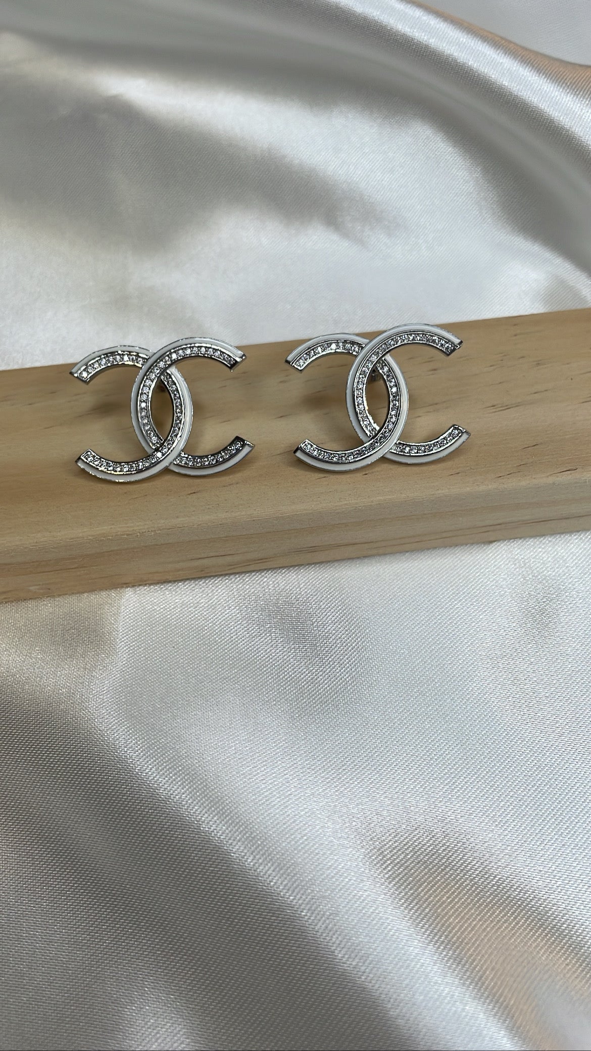 Silver and white earring with stones
