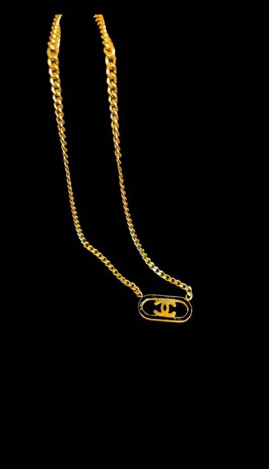 Golden necklace with black stones